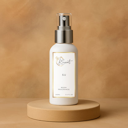 LeScent SU room fragrance spray bottle presented on a smooth tan pedestal with a warm caramel backdrop and clean studio lighting, inspired by Kayali Vanilla 28.