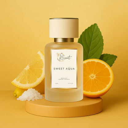 LeScent Sweet Aqua hair perfume, hair fragrance, hair perfume mist bottle displayed with sliced lemon, sliced orange, coarse white salt crystals, and fresh green leaves arranged around the pedestal, inspired by Creed Millésime Impérial.