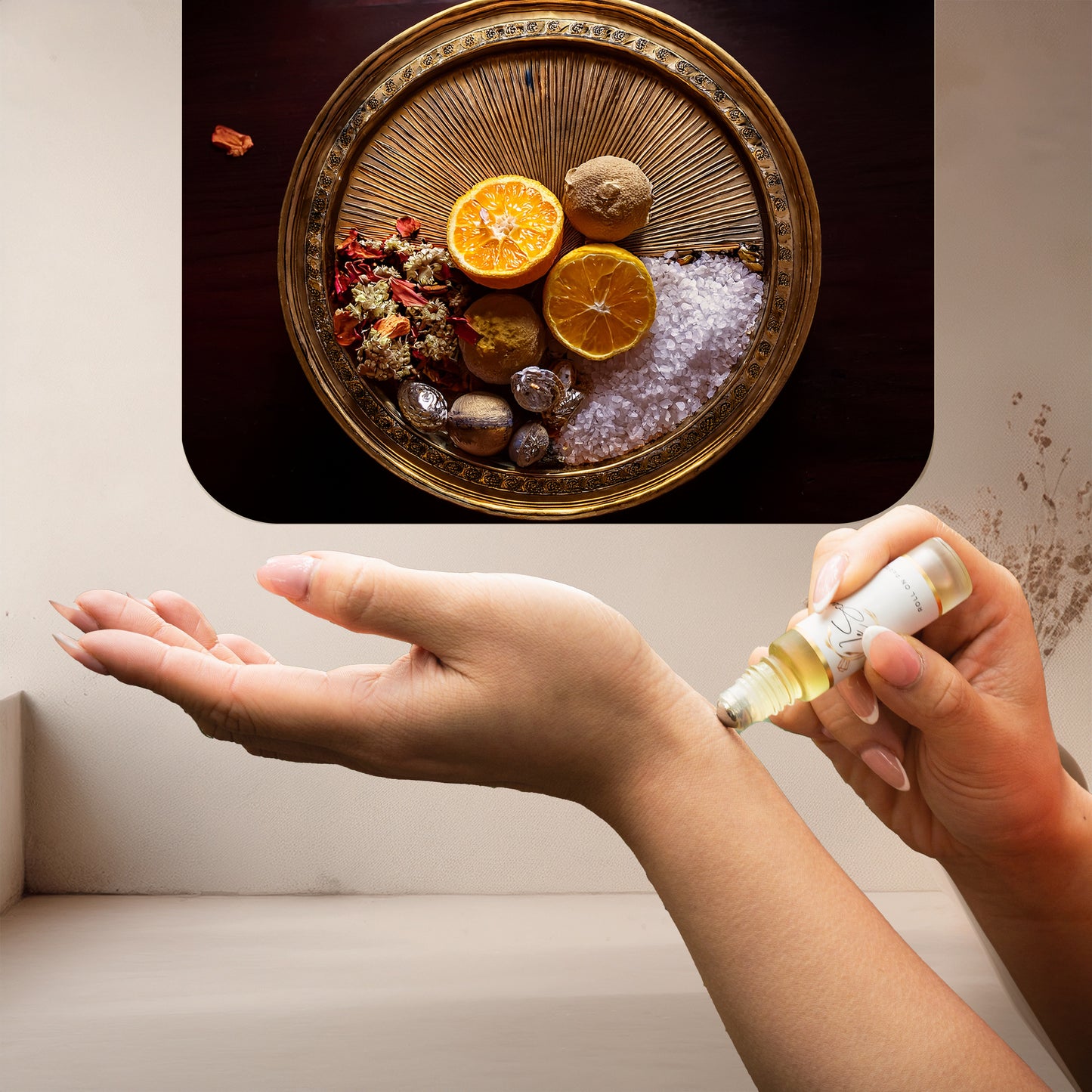 Applying LeScent Sweet Aqua perfume oil roll-on to the wrist, with an ingredient panel showing sliced oranges, whole citrus fruits, bath salts, dried botanicals, and metallic decorative stones arranged on a round golden tray, inspired by Creed Millésime Impérial.