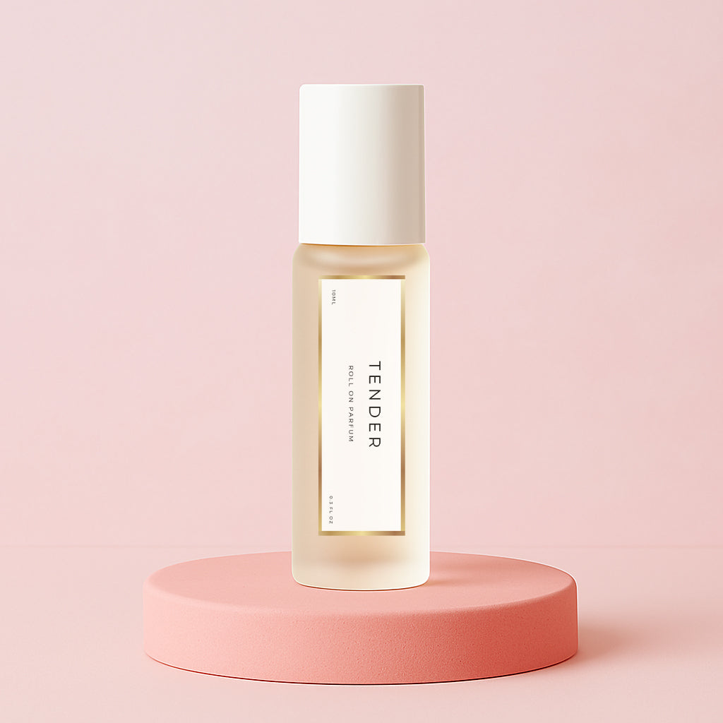 LeScent Tender perfume oil roll-on bottle on a pink pedestal with a solid pink background, inspired by Chanel Chance Eau Tendre.