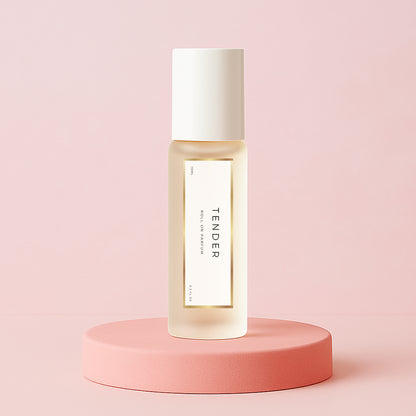 LeScent Tender perfume oil roll-on bottle on a pink pedestal with a solid pink background, inspired by Chanel Chance Eau Tendre.
