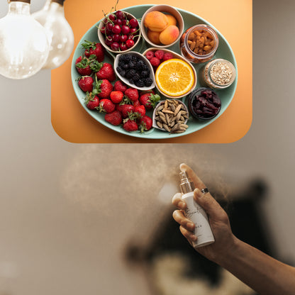 Spraying LeScent That Girl room spray inspired by Burberry Her — fruity floral home fragrance freshener mist with berries, amber and jasmine for an elegant feminine scent.