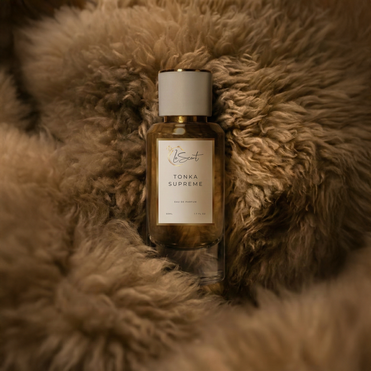 LeScent Tonka Supreme inspired perfume bottle resting on soft warm-toned fur with golden lighting. Inspired by Dior Fève Délicieuse.