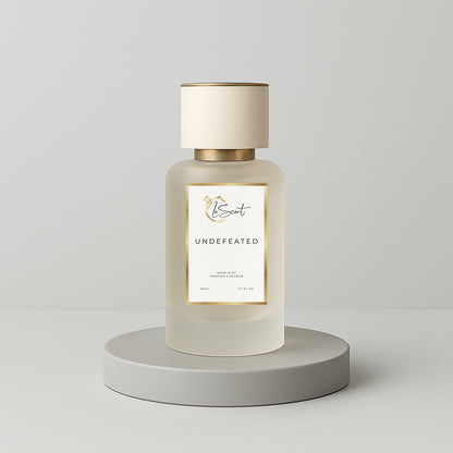 LeScent Undefeated hair perfume, hair fragrance and hair perfume mist bottle on a soft grey background inspired by Paco Rabanne Invictus.