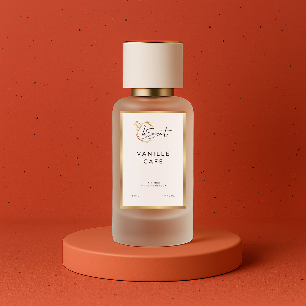 LeScent Vanille Café hair fragrance mist bottle on a matte terracotta base with soft caramel lighting and red clay background, inspired by Yves Saint Laurent Black Opium.