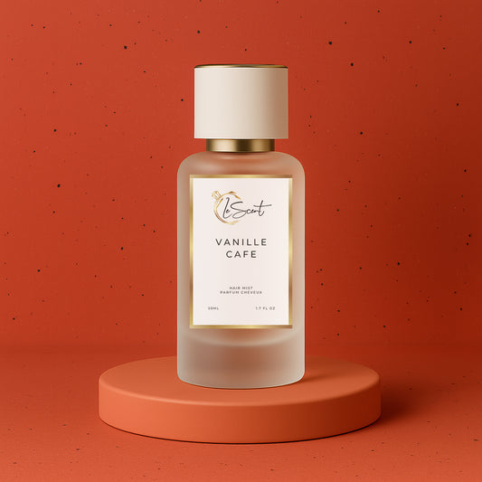 LeScent Vanille Café hair fragrance mist bottle on a matte terracotta base with soft caramel lighting and red clay background, inspired by Yves Saint Laurent Black Opium.