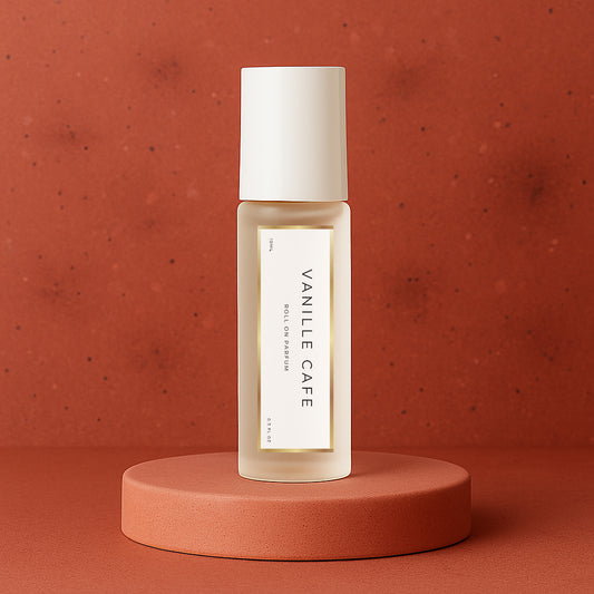 LeScent Vanille Café roll-on perfume oil bottle on a warm terracotta platform with rich matte red background and soft lighting, inspired by Yves Saint Laurent Black Opium.