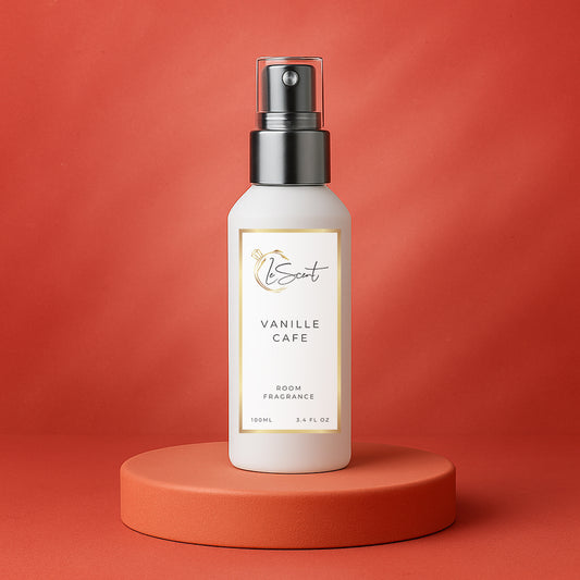 LeScent Vanille Café room fragrance spray bottle on a deep terracotta pedestal with warm red background and elegant gold tones, inspired by Yves Saint Laurent Black Opium.