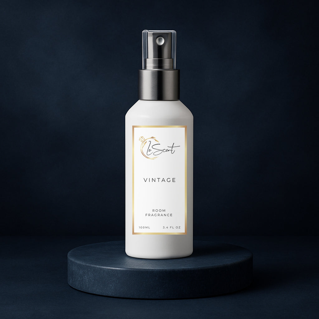 LeScent Vintage room fragrance spray bottle displayed on a deep navy pedestal with a rich midnight background and soft reflective light, inspired by Parfums de Marly Layton.