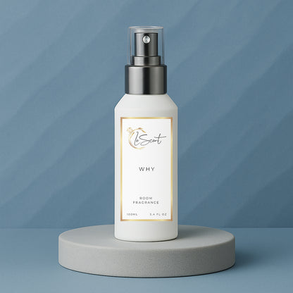 LeScent Why room fragrance spray bottle displayed on a grey-blue pedestal with subtle textured background, inspired by YSL Y.