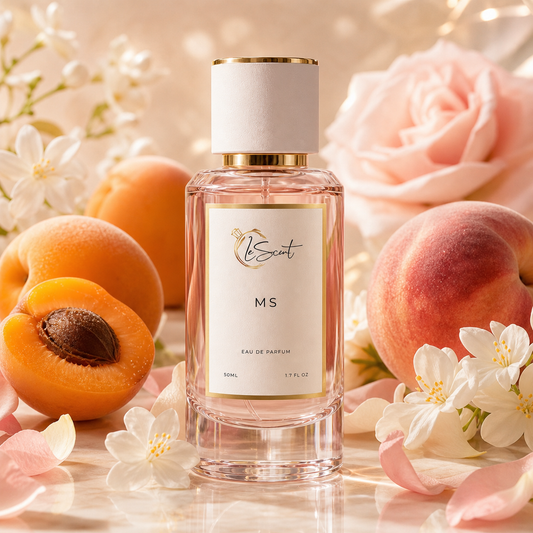 A perfume bottle labeled 'LeScent MS' stands centered on a glossy surface, surrounded by peach fruits, white blossoms, and soft pink petals in a warm, softly lit setting.