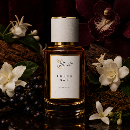 A bottle of Scent Orchid Noir Eau de Parfum centered on a dark reflective surface, surrounded by white orchid flowers, dark berries, green leaves, and rich brown wood. The bottle has amber liquid, a white label with gold trim, and a white cap with a gold band.